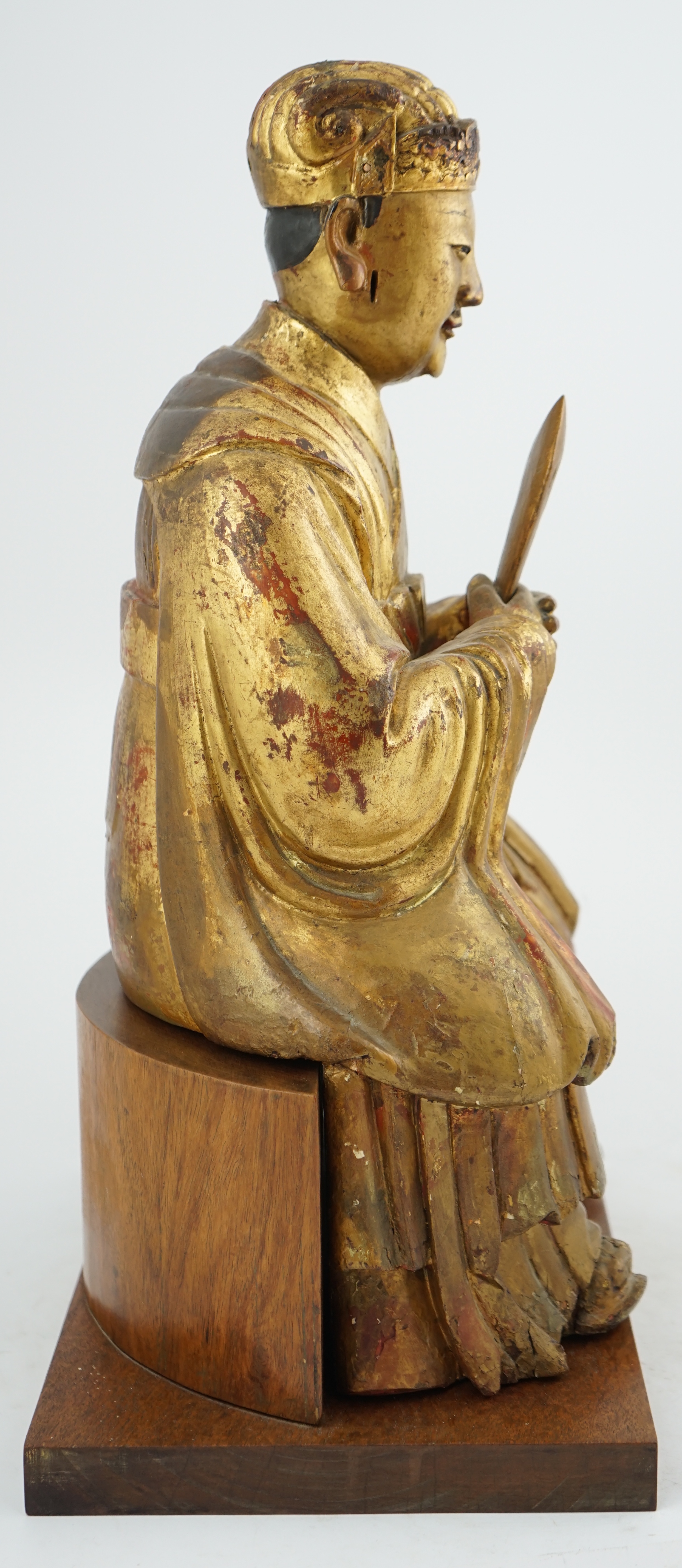 A Chinese gilt lacquered wood seated figure of Wenchang Wang, late Ming, 17th century